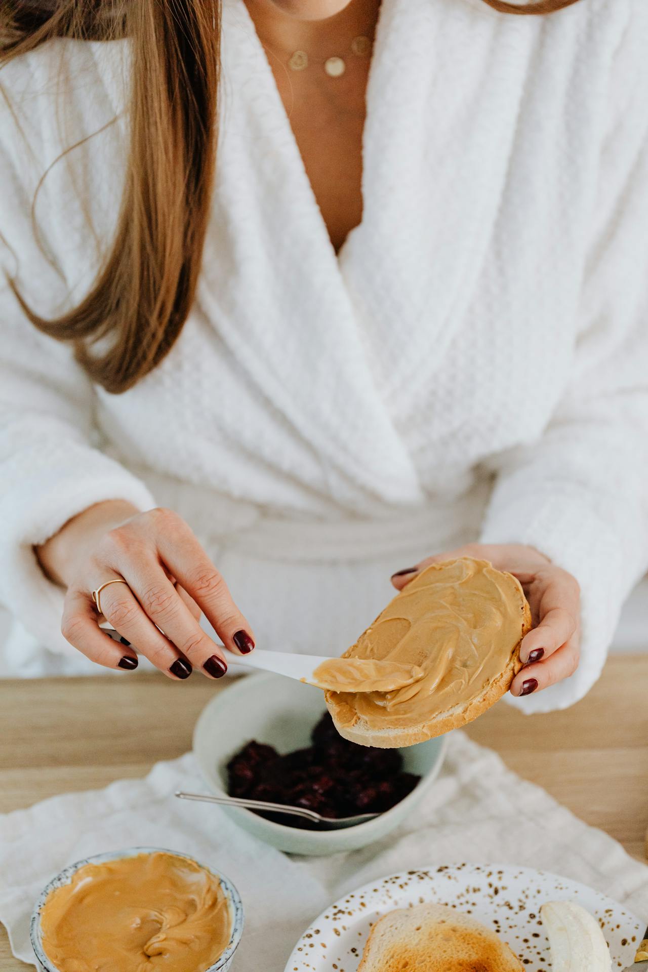 woman spreading peanut butter